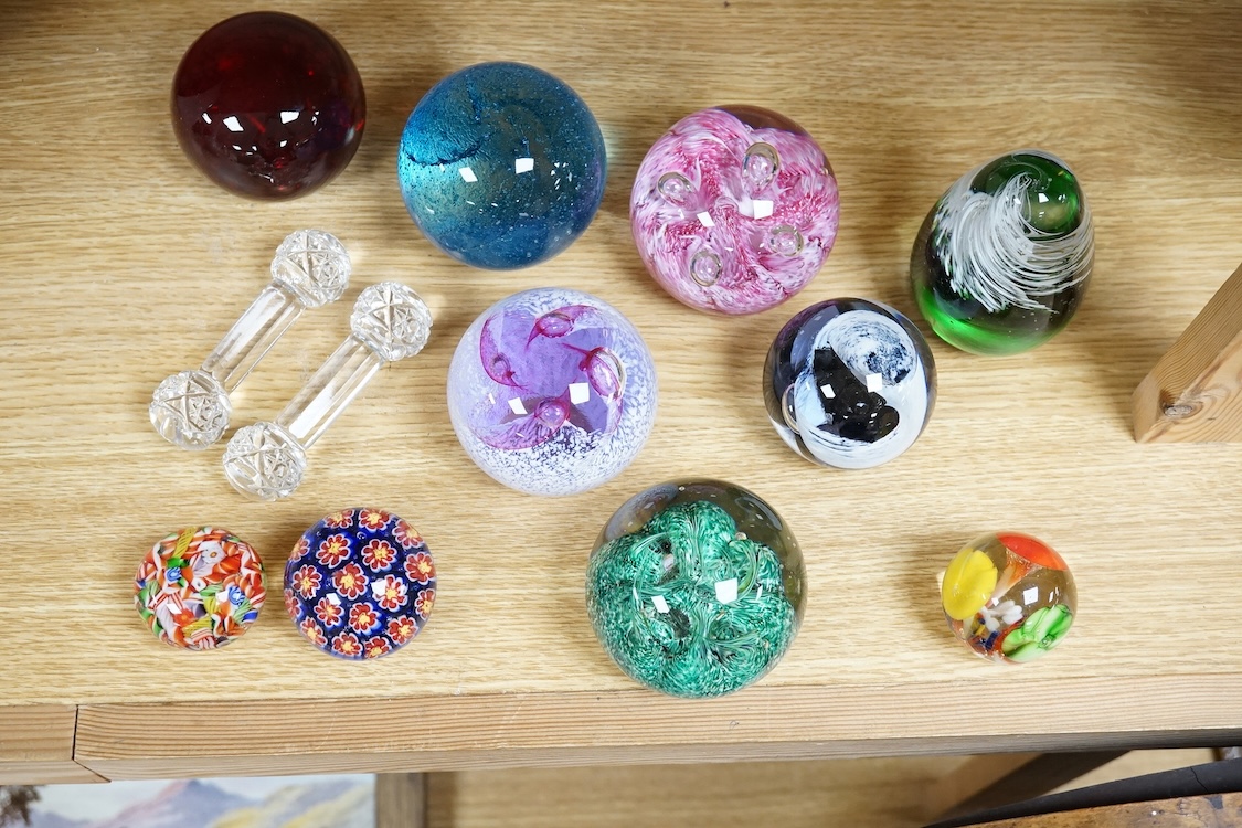 A collection of glass paperweights to include Caithness and millefiori examples, largest 10cm high
